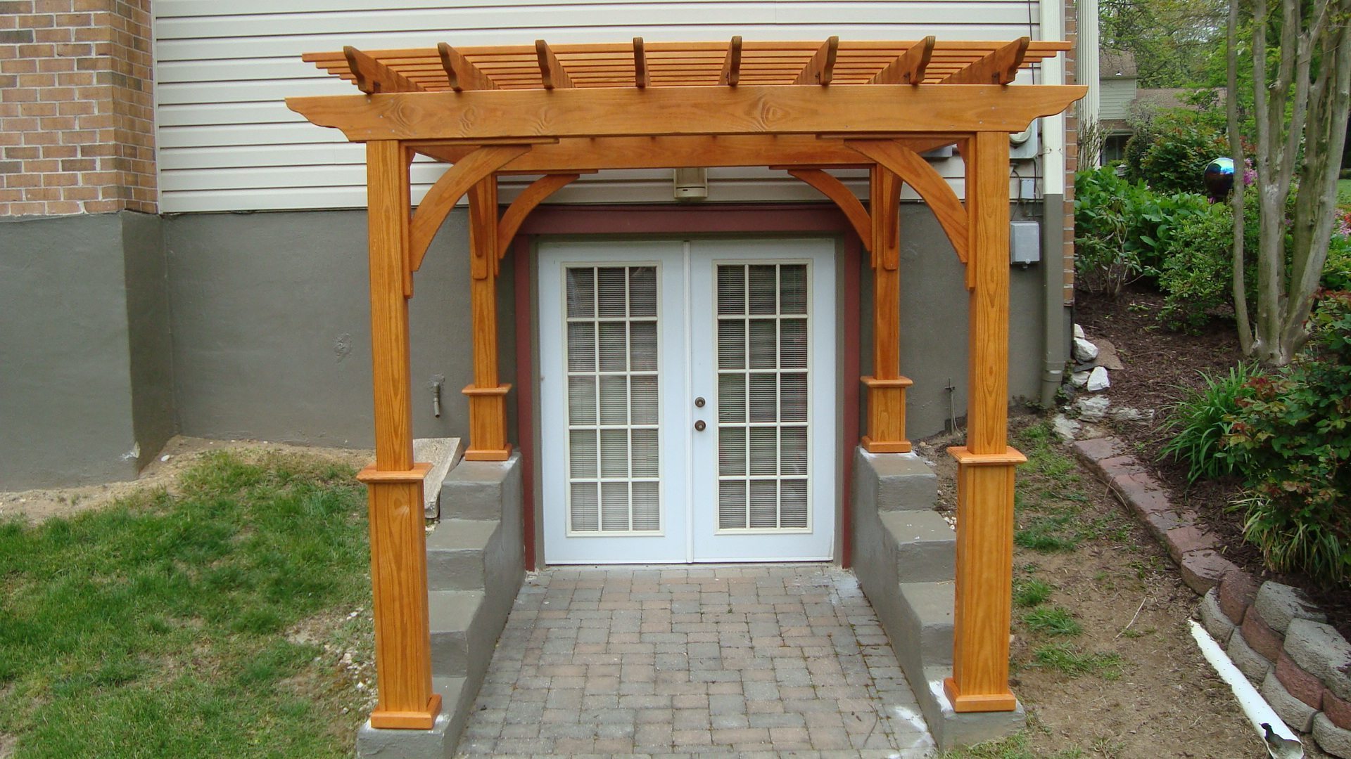 Wood pergola with cedar stain.